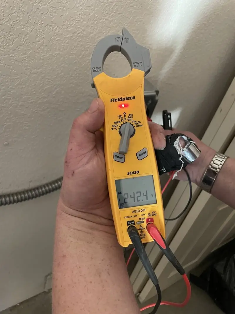 Voltage testing with clamp meter during Electrical Installation Services in Bensley